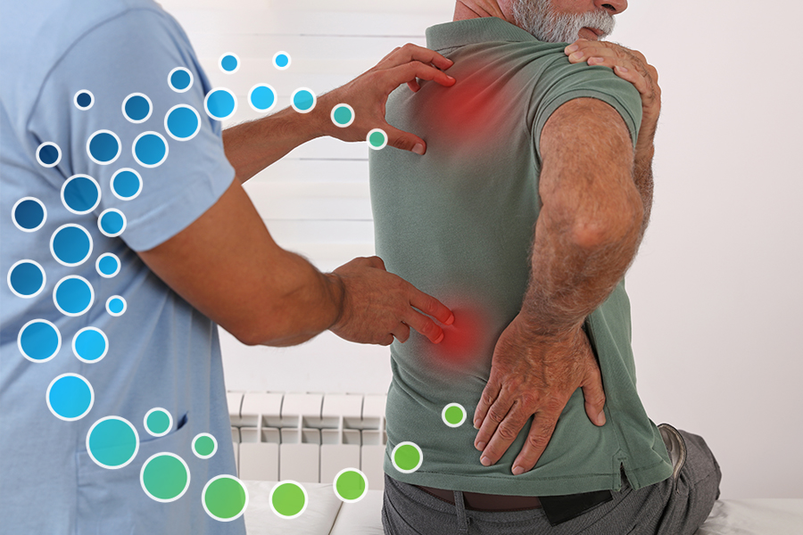 Man at a doctor office showing the doctor his back with two red pain points where the doctor's hand touch his back.